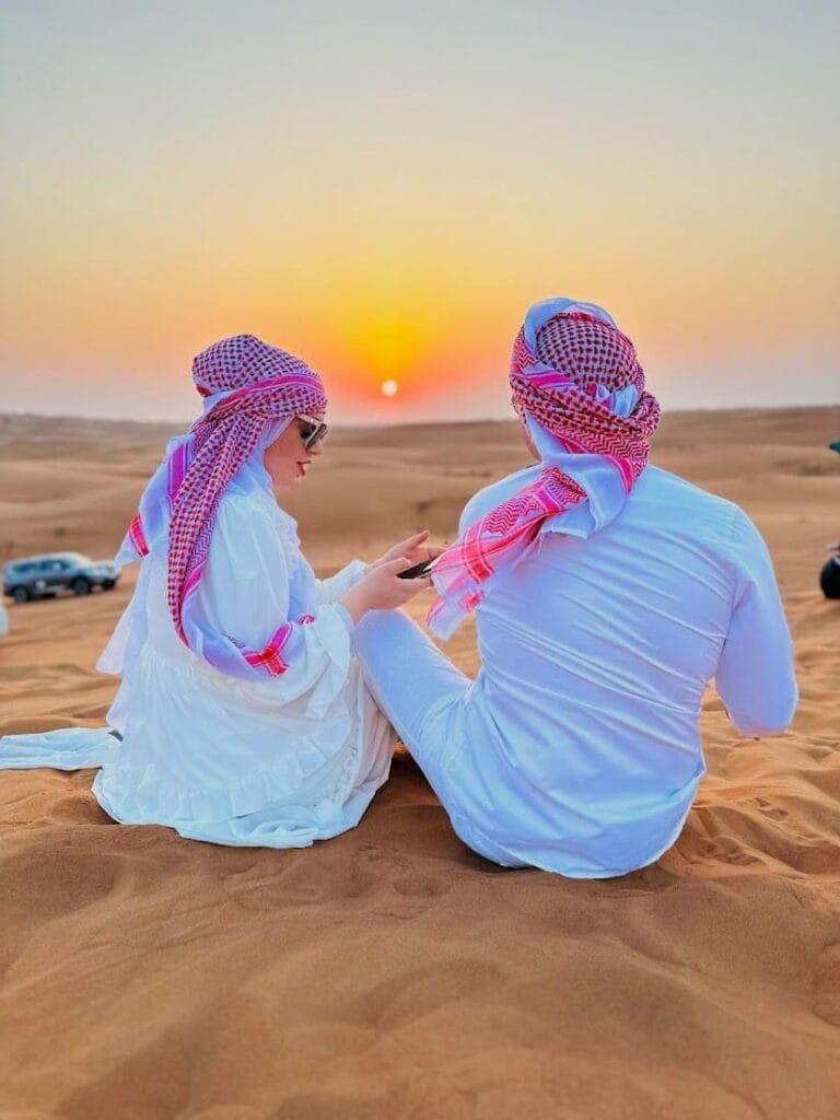 Desert safari sandboarding on golden dunes