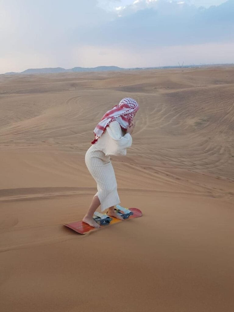 Desert safari camel ride at sunset