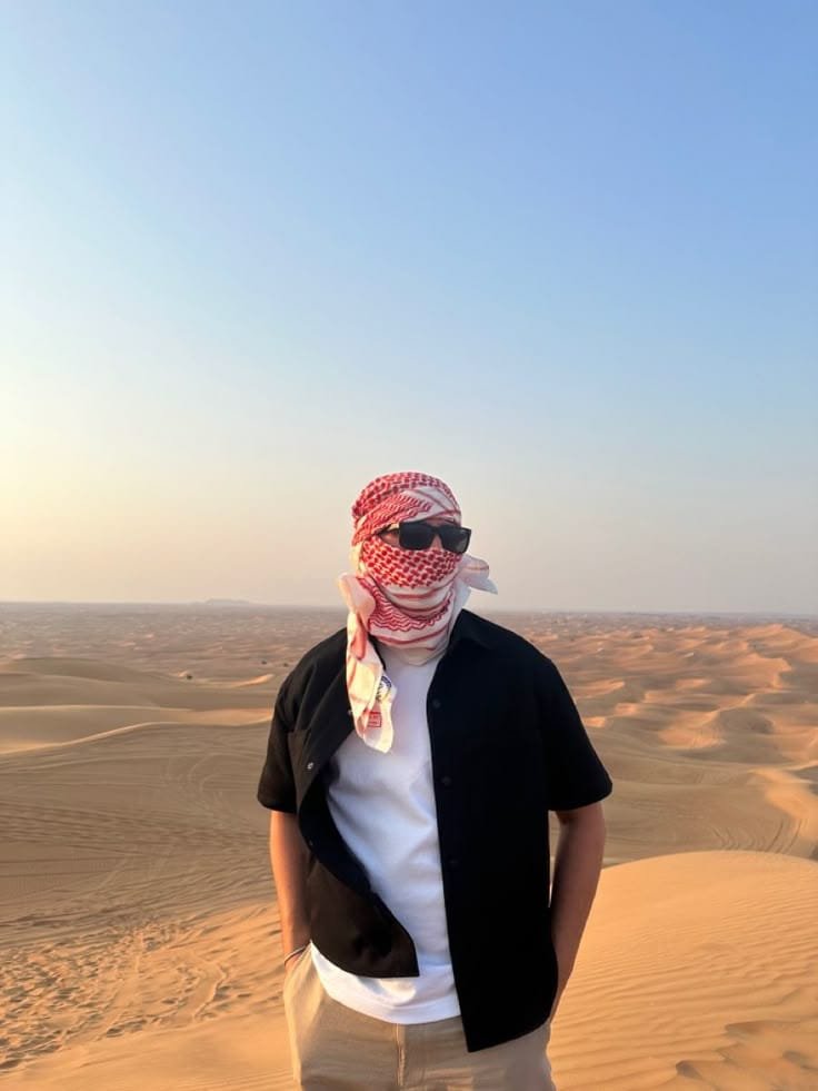 Camp seating and dunes at our private desert dinner venue