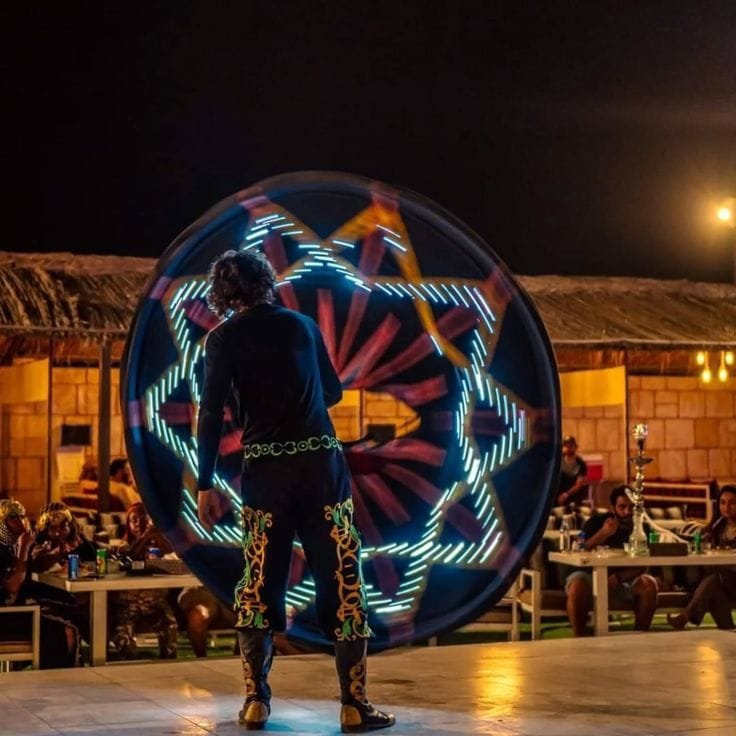 Tanoura dancer performing the spinning skirt show at the desert camp