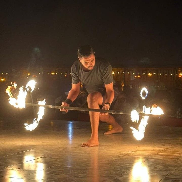 Fire show performer at night at the Abu Dhabi desert camp