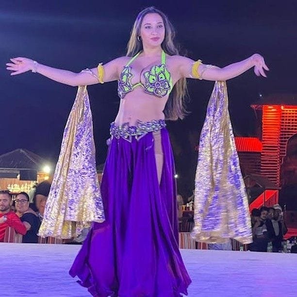 Belly dance performance viewed from the front-row VIP majlis at the desert camp