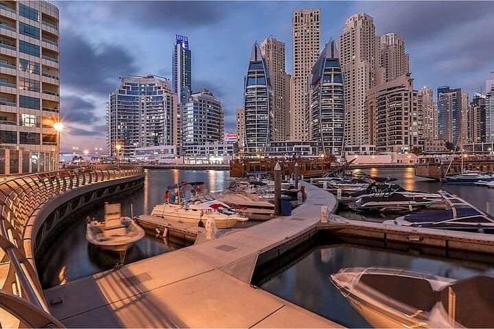 Yachts moored at Dubai Marina in the blue hour, seen on the evening Dubai city tour