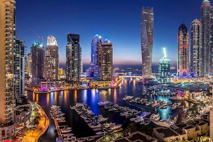Dubai Marina lit up at night, seen on an evening Dubai city tour