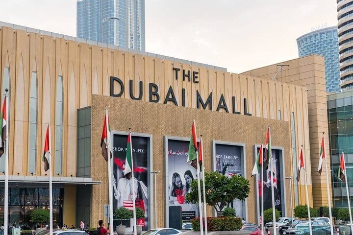 The Dubai Mall main entrance with UAE flags, the final stop on the half-day Dubai city tour