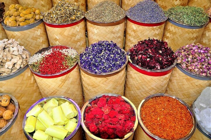 Woven baskets of dried flowers and spices at the Spice Souk, visited on the old Dubai city tour