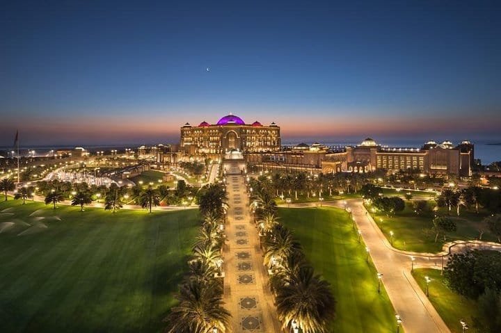 Emirates Palace Gardens at Dusk Emirates Palace and its floodlit gardens at dusk in Abu Dhabi