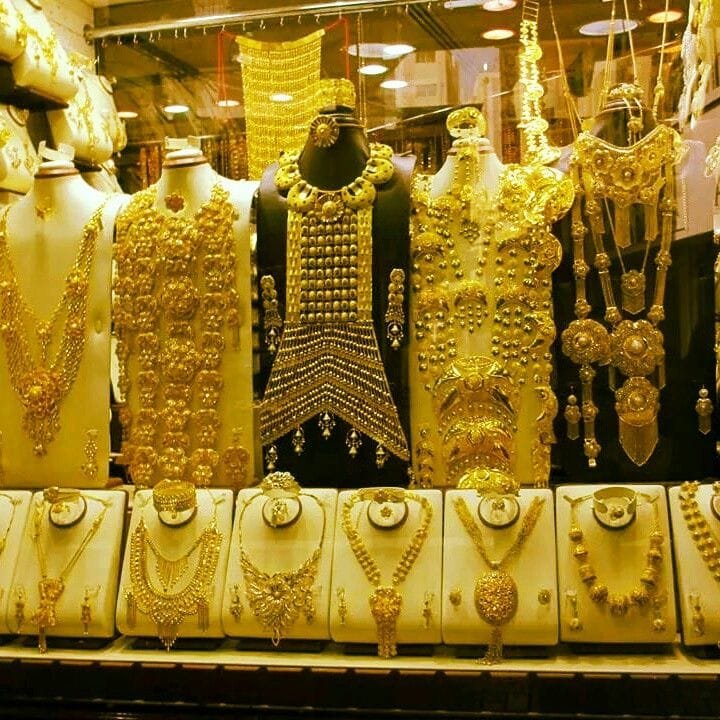 Gold necklaces on display in a Deira souk shop, Dubai