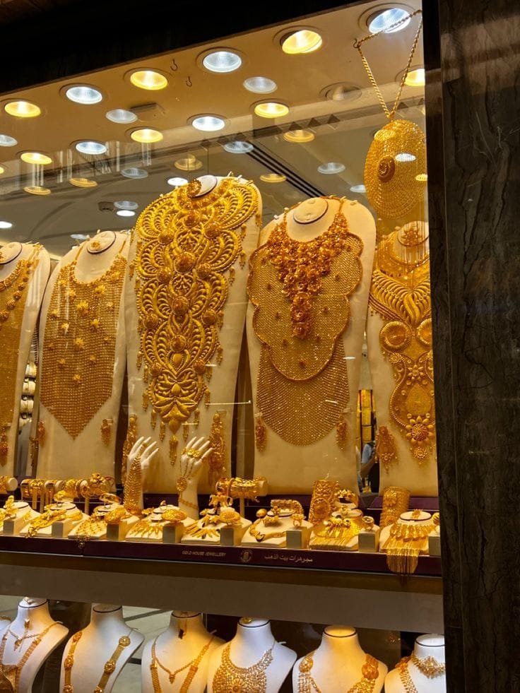 Shop window packed with gold jewellery in the Dubai Gold Souk