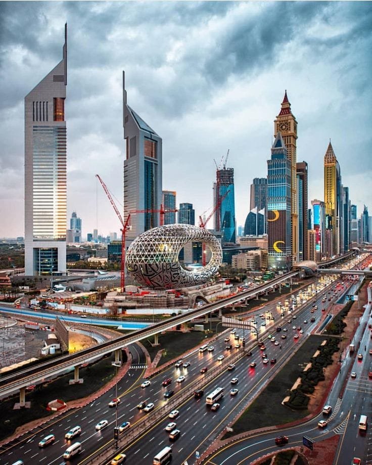 Sheikh Zayed Road with Dubai skyline under cloudy sky