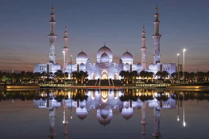 Grand Mosque at Dusk Sheikh Zayed Grand Mosque at dusk, its domes reflected in the surrounding pool