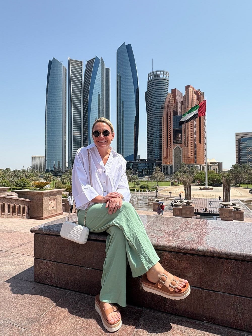 Guest Photo on the Corniche A guest photographed on the Abu Dhabi Corniche with Etihad Towers behind