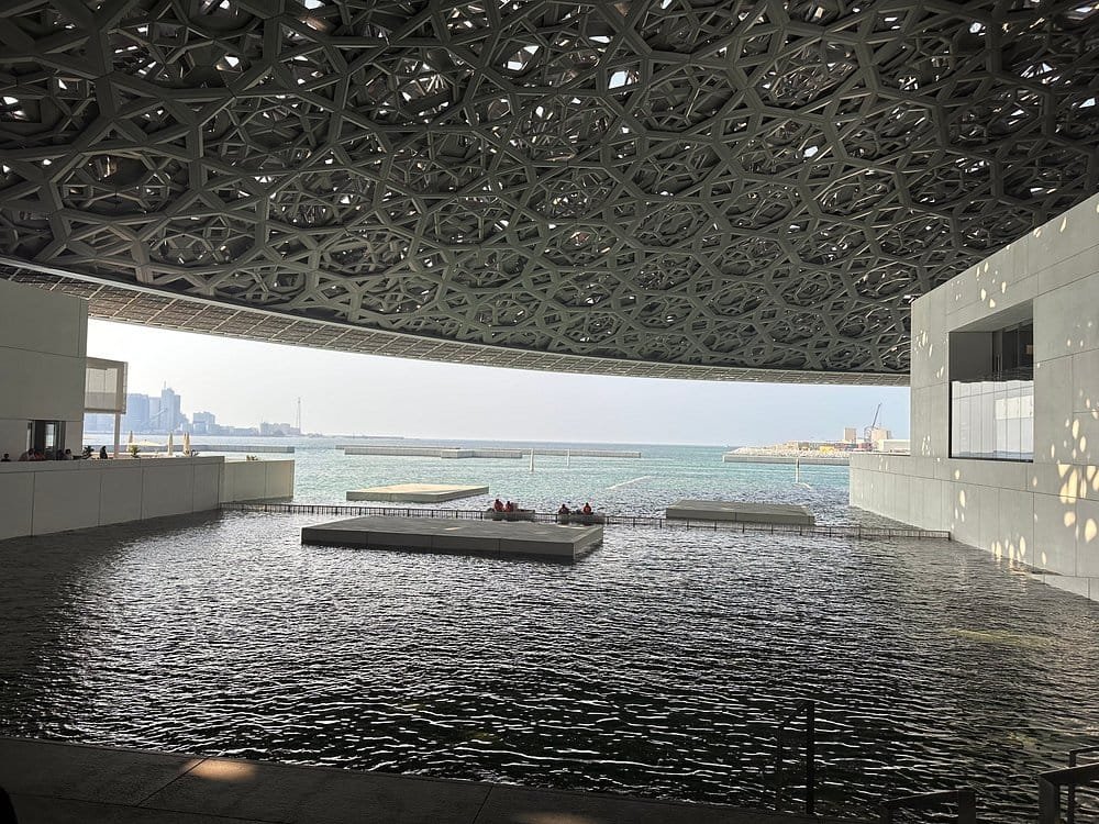 Louvre Abu Dhabi Dome The perforated dome of Louvre Abu Dhabi casting its rain of light over the water