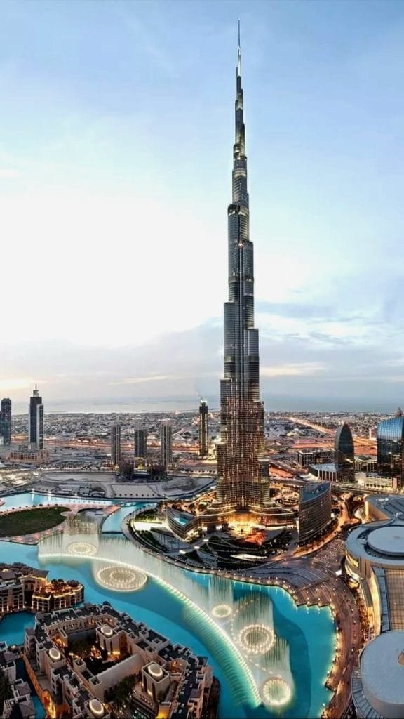 Downtown Dubai skyline with Burj Khalifa glowing at dusk