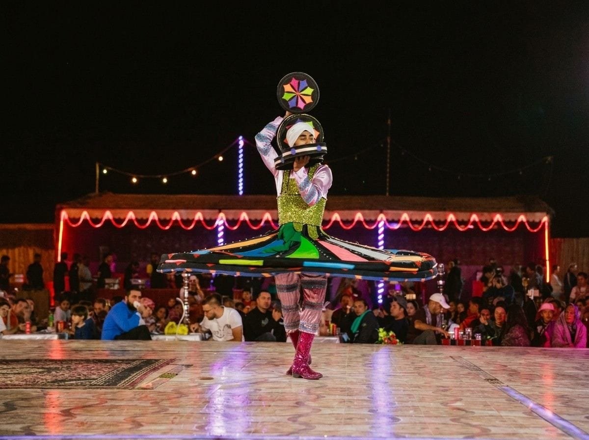 Tanoura dancer spinning in an illuminated skirt at the desert camp on an Abu Dhabi stopover evening